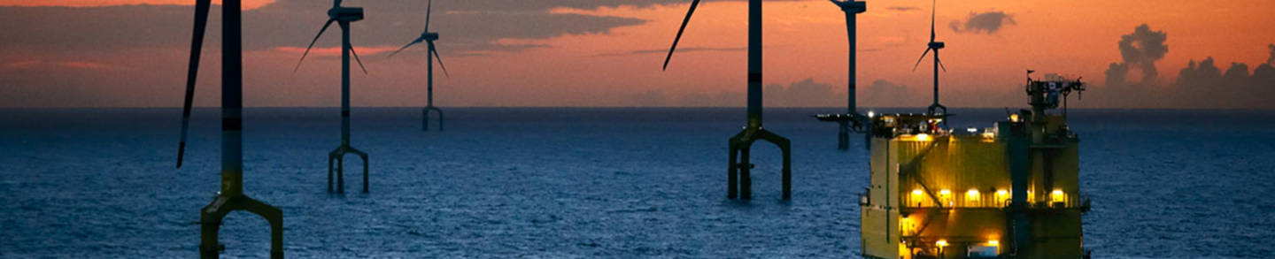 Offshore windmills in sunset